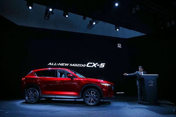 LOS ANGELES, CA - NOVEMBER 16:  Akira Marumoto, Executive Vice President of Mazda, speaks onstage at the Mazda press conference event at the L.A. Auto Show on November 16, 2016 in Los Angeles, California.  (Photo by Victor Decolongon/Getty Images for Mazda Motor Co.) *** Local Caption *** Akira Marumoto